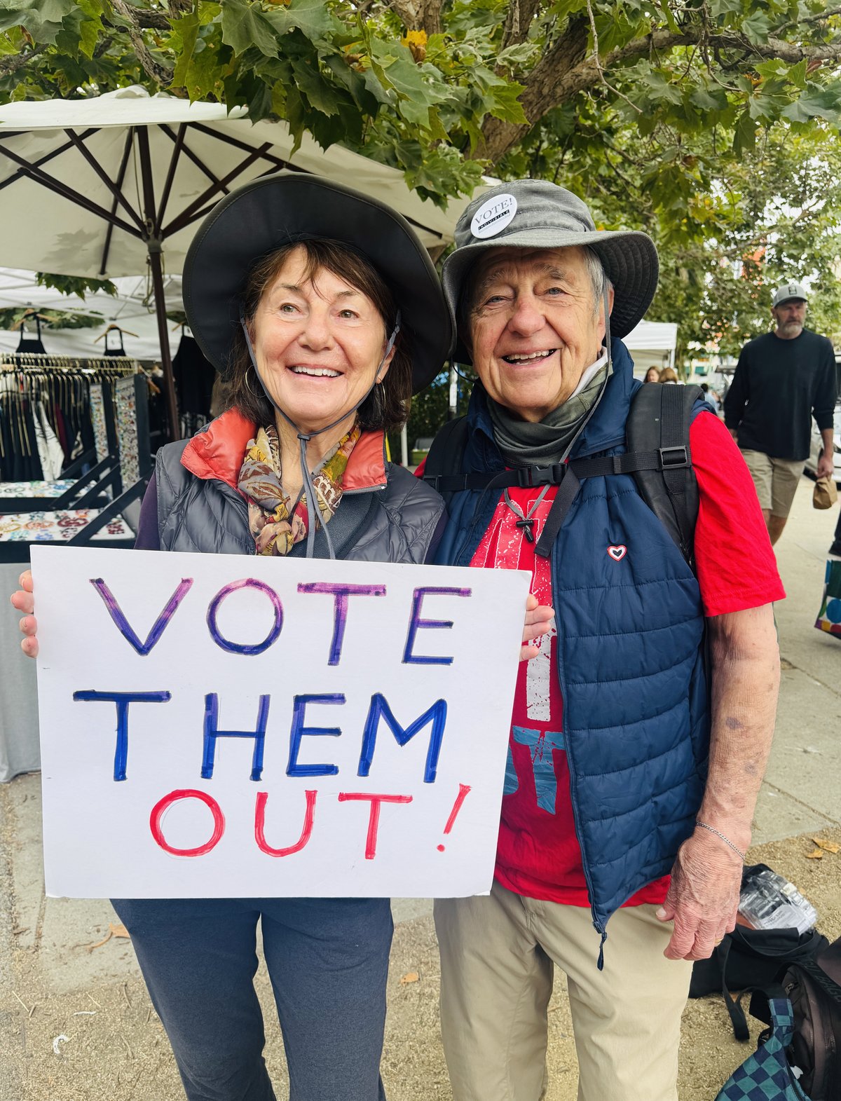 RAEB volunteers holding a Vote Them Out sign